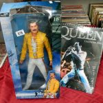 A Freddie Mercury doll and Queen calendar