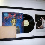 A framed & glazed Queen collagefeaturing a signed copy of Metropolis by Freddie Mercury picture